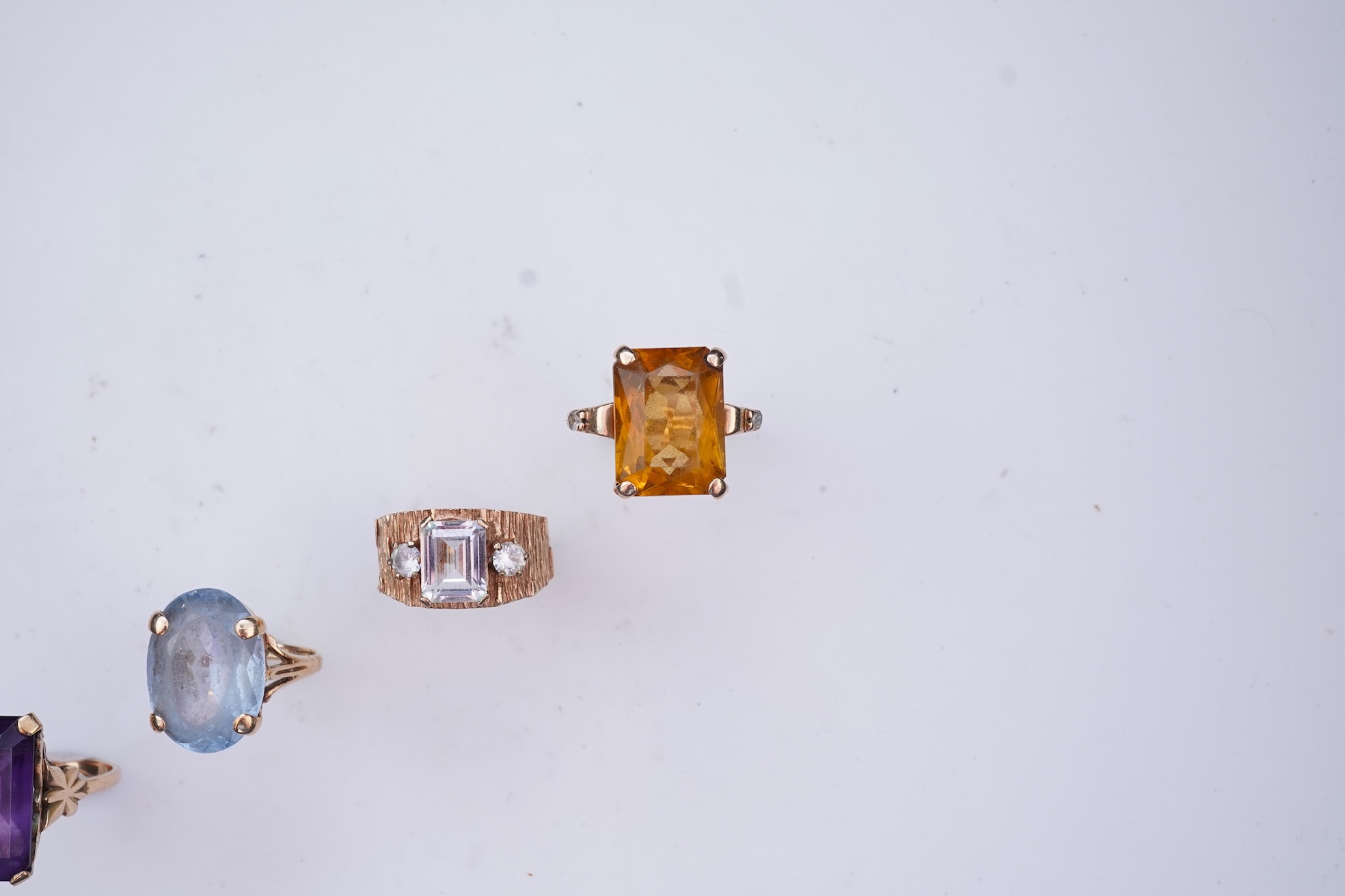 Four gem-set rings